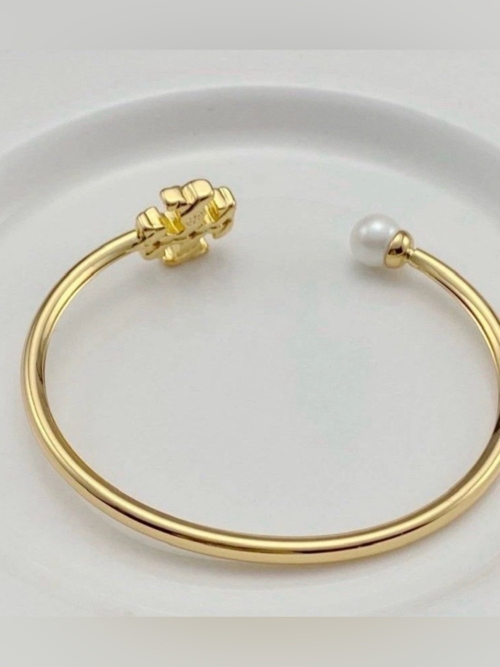 Tory Burch Gold Open Cuff Bracelet with White Pearl and Gold Logo - Picture 2 of 3